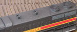 Roof photo showing scratchbuilt spark arrestor frames. The spark arrestor screens themselves have been removed by the early 1990s period this model represents.