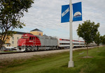 The Hawkeye Express heads east with another load of fans from the depot at Coralville, IA.  02-Sept-2006.