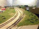 Looking west at Atlantic yard, with new static grass and other scenery on both sides of the tracks.  The stock track in the foreground is out of service.