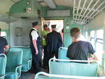 Passengers and crew enjoy the breeze and 706's accompanyment.  The conductor at left is list lurker Jim Goodin from Blue Grass.