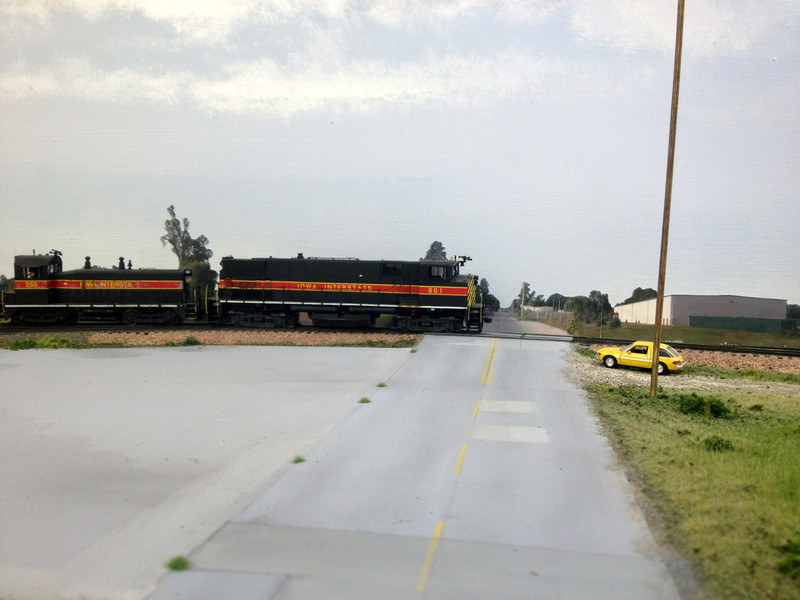 CBSW pulls west over S. 16th St., past the abandoned Ready Mixed concrete plant at the east end of UP's Pool Yard.  For other photos, please see my blog at http://model-railroad-hobbyist.com/blog/joe-atkinson .