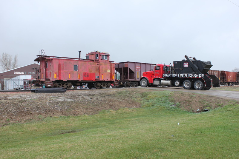 The caboose is in ballast train service again today, west of Durant here.  April 11, 2013.