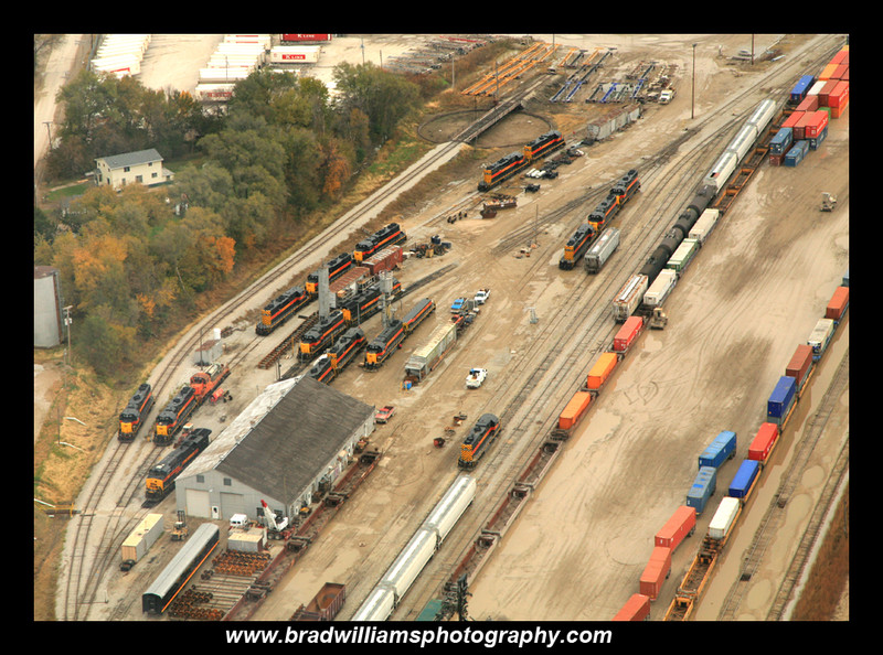 Brad Williams' November 2009 aerial view of Bluffs yard (used with permission) gives a nice overview of what I'm trying to model...minus the GEs and all the November mud.  From left to right, this view shows the Bluffs engine facility, rip tracks, yard, and intermodal ramp.