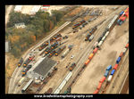 Brad Williams' November 2009 aerial view of Bluffs yard (used with permission) gives a nice overview of what I'm trying to model...minus the GEs and all the November mud.  From left to right, this view shows the Bluffs engine facility, rip tracks, yard, and intermodal ramp.