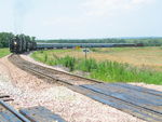 Steam train is cleared up on the east leg at Yocum while 701 attaches the business cars to the rear.