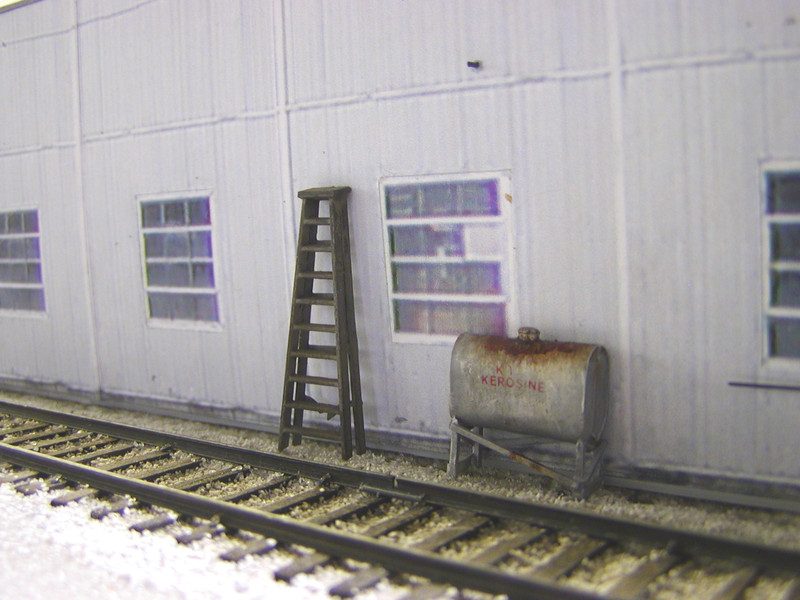 Model view of the above scene.  The tank is a kitbashed SS Ltd. #2411 model with Microscale alphabet decals, while the ladder is a modified Central Valley offering, with rungs broken according to the prototype.