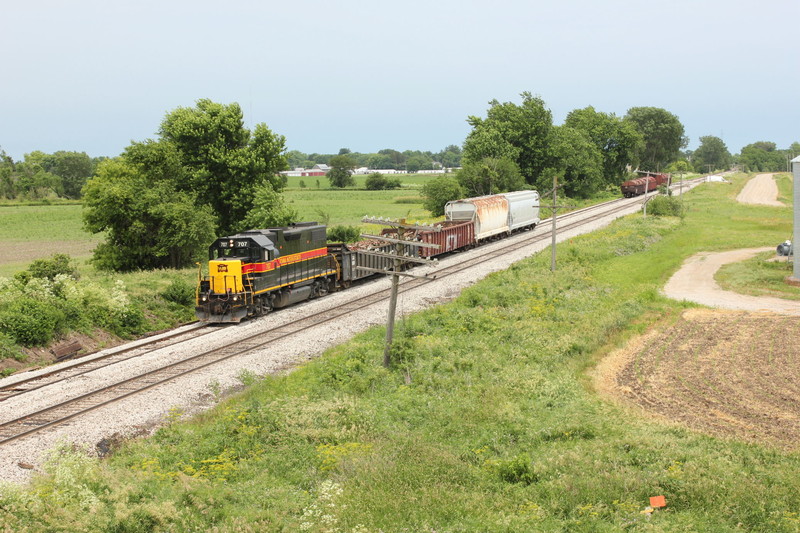 Cleared up on the siding at N. Star, the crew is heading west to work JM.