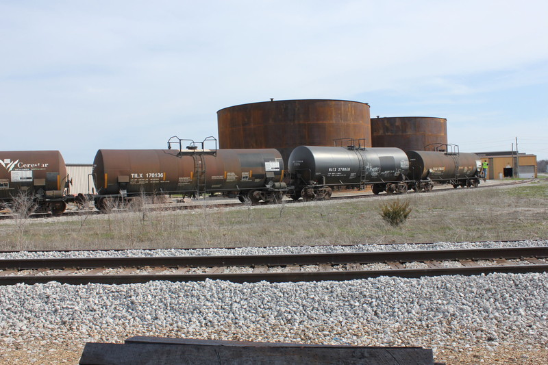 Wilton Local crew is spotting tanks at new customer Vitalix in Wilton.  This industry is on the same siding as Wilton Precision Steel, the yellow building in the background.