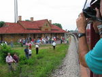 Coach passengers are back on board while the train pulls ahead to load the rich folks.