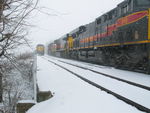 EB crosses the small bridge on Twin States siding and meets the tie train.