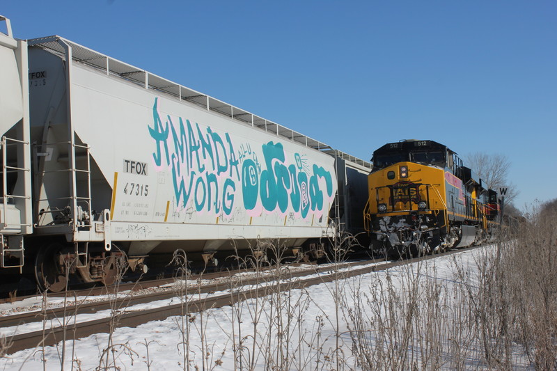 EB passes JM cars on the Wilton Pocket, Jan. 12, 2015.  I liked the graffiti on that center flow.