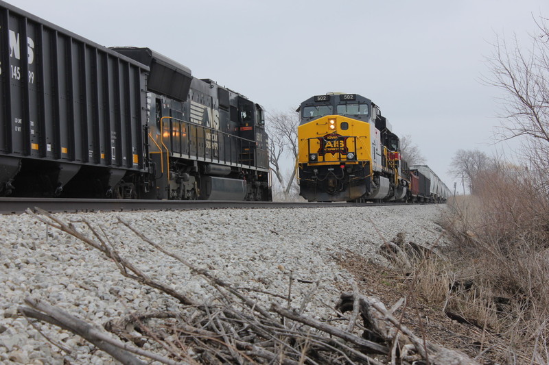 WB meets coal mtys with NS power at the east end of Walcott siding, March 28, 2014