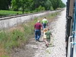 These lucky passengers won a raffle to ride the cab; here they walk to the head end at Colfax.