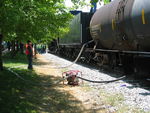 Transferring water from the tank car to the tender in Newton.
