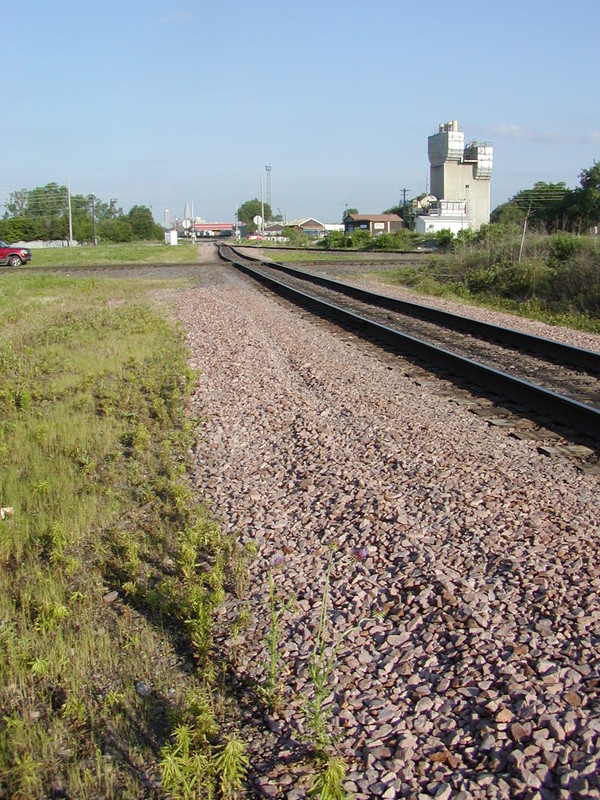 A view of the abandoned cement plant as it appeared in my era, taken from the SE quadrant of the IAIS/UP crossing, looking west.  The Walthers ready mix plant is close enough to this structure that I decided to kitbash that rather than scratchbuild.