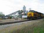 EB crew is blocking their train at N. Star; engines shown here at the cement batch plant in Wilton to be used for a big paving project east of town this summer, that will surely disrupt much railfan traffic.