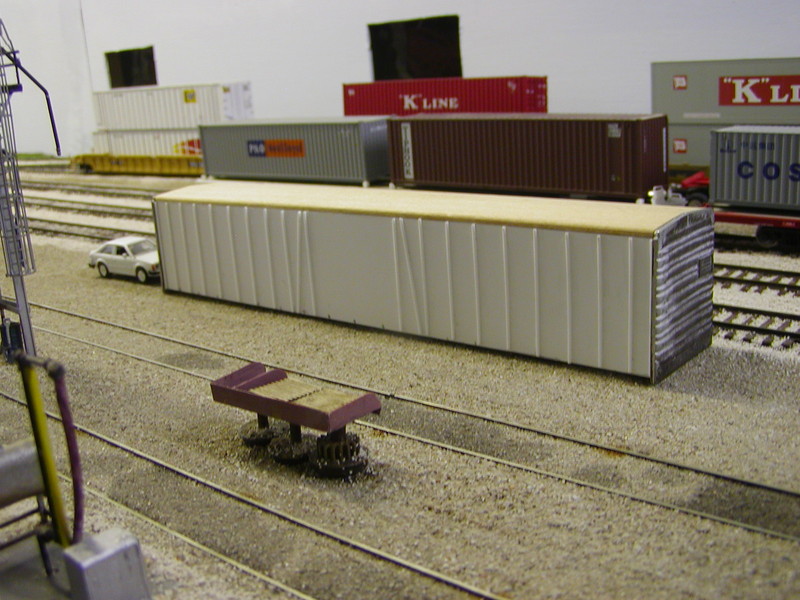 My model of the Q box car.  I started with an Ambroid wood kit, but preferred to work in styrene, so I cut new sides and ribs.  Still need to add the roll-up door, the original door in the open position, and the ribs on the roof and far side.