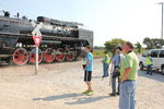 "The Gang" at the west end of S. Amana.  Trainboy Alex, Dennis Dougherty of the steam crew, Stewart Buck and Frank Grizel enjoy the show.