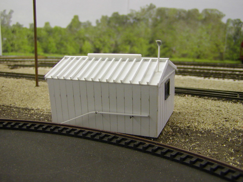 MOW shed looking SW.  Window is a modified Grandt Line item, and electrical conduit head is a modified P2K MU receptacle.  I plan to paint and weather this in the coming week, followed by blending it and the turntable pit (foreground) into the surrounding scenery.