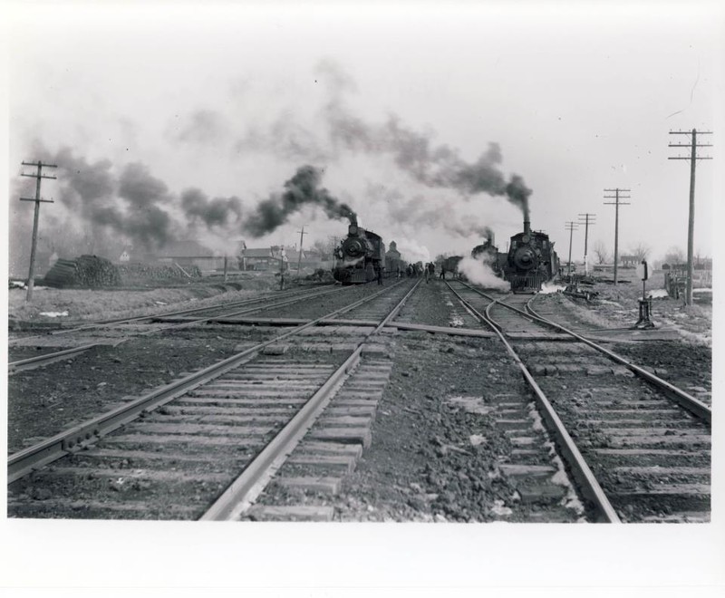 Not sure if others are interested in this, but this is looking east at Wilton from the Liberty St. crossing (farthest west crossing in town, visible in the background of the previous shot).  Off to the right, little more than a trail of weeds, is the old west leg of the wye that used to go to Muscatine.  Visible in the background between the trains is the depot that still stands.