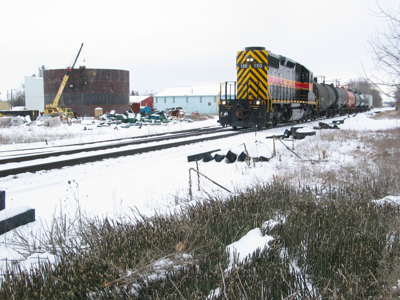 After dropping their Wilton cars to the Pocket, the Local crew heads east with cars for Twin States.  The large tank being built in the background definitely has my interest piqued...