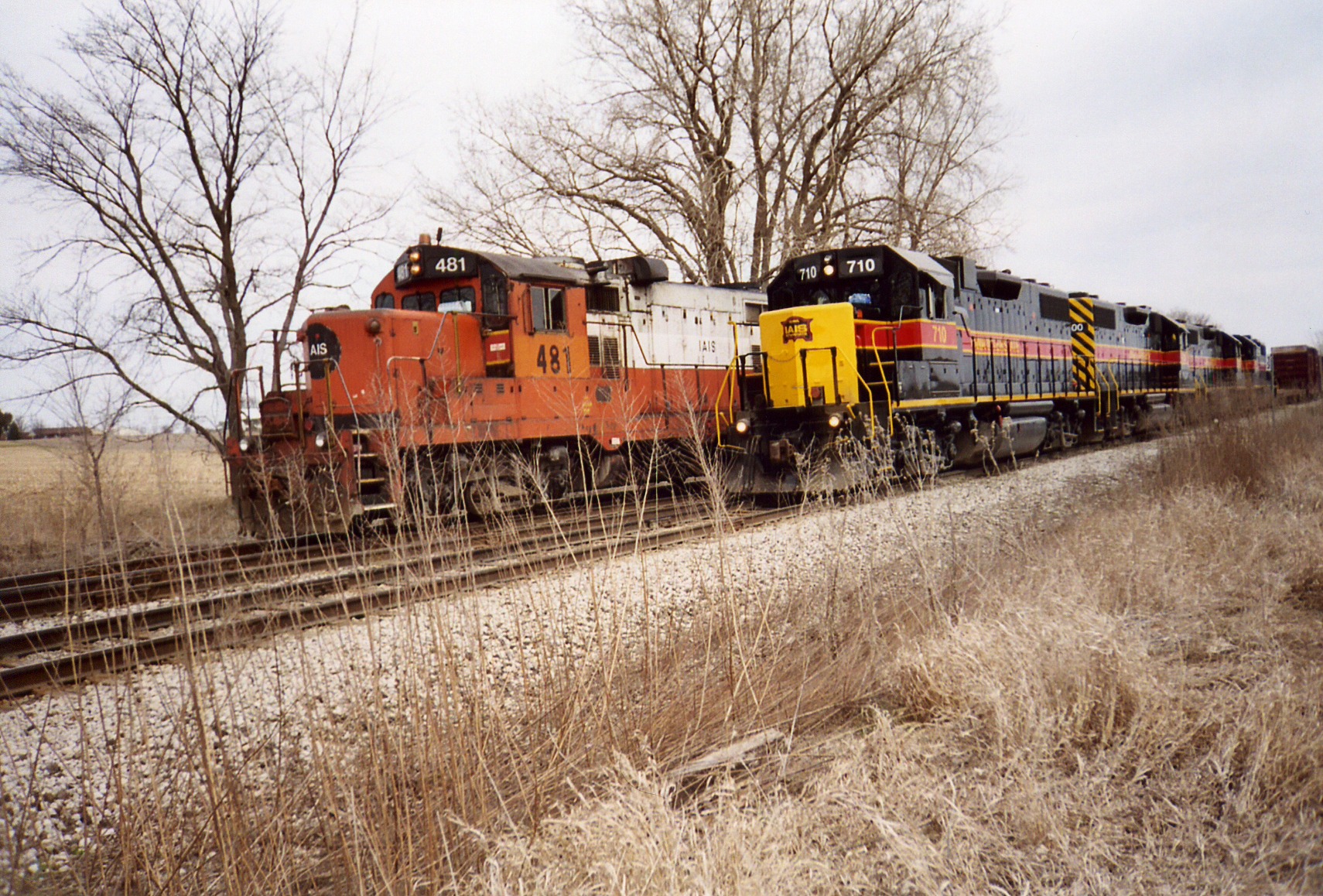 The westbound passes the Wilton Local, eng. 481, at the N. Star crossover.  March 29, 2005