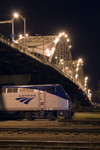 A chartered Amtrak train using MILW 261 equipment sits in BNSF's Lower Yard under the Centennial Bridge.  Rock Island, IL 12-May-2007.