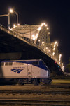 A chartered Amtrak train using MILW 261 equipment sits in BNSF's Lower Yard under the Centennial Bridge.  Rock Island, IL 12-May-2007.