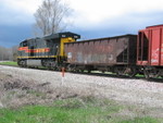 Neat little work train; the first westbound had 7 ballast loads for the wreck site; the crew cut off their lead engine at N. Star and took the ballast over to dump enough to get the track stabilized for the first eastbound.  Here they're backing eastward through Moscow, towards their train at N. Star.