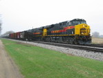 The crew has shoved the ballast cars onto their train in the siding, and is tieing onto the rest of their power on the main.