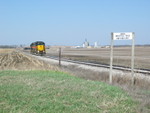 After cutting off the 3 ballast cars on the west end of Atlantic siding, the crew is heading up the Audubon branch to get grain loads from the elevator.