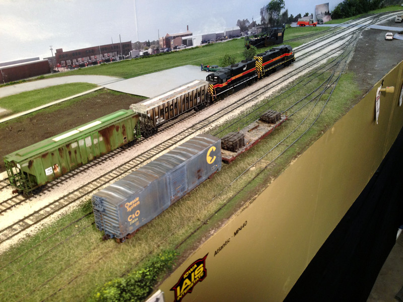 Layout view looking west. The grass is a bit taller than in the previous prototype pic, which was taken five years after my era, after they'd cleared off #4 track a bit to allow transload operations there.