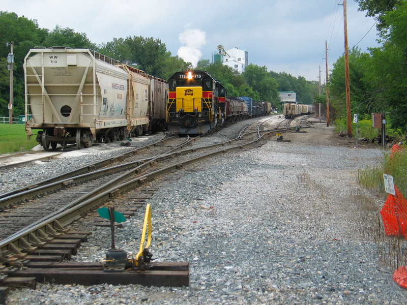 East train has just picked up several cars off the Chessie "interchange track" at Utica, and is backing up to tie onto their train.  Aug. 29, 2006.