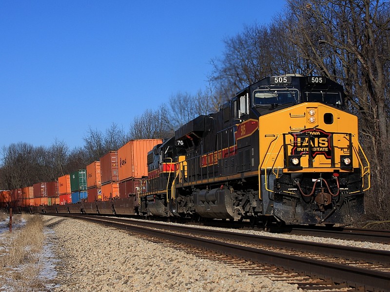 AIS 505 east Heads a stack train out of Joliet on a cold Sunday morning. The RI tracks are the southern border of Highland Park, one of the oldest parks in Joliet.