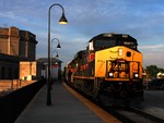 The day comes to a close as IAIS 502 passes UD Tower and Joliet's Union Station after getting the signal for bridge 407