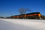 IAIS 700 roars past New Lenox Metra Station as the morning sun makes an appearance after a 6" snow storm the night before