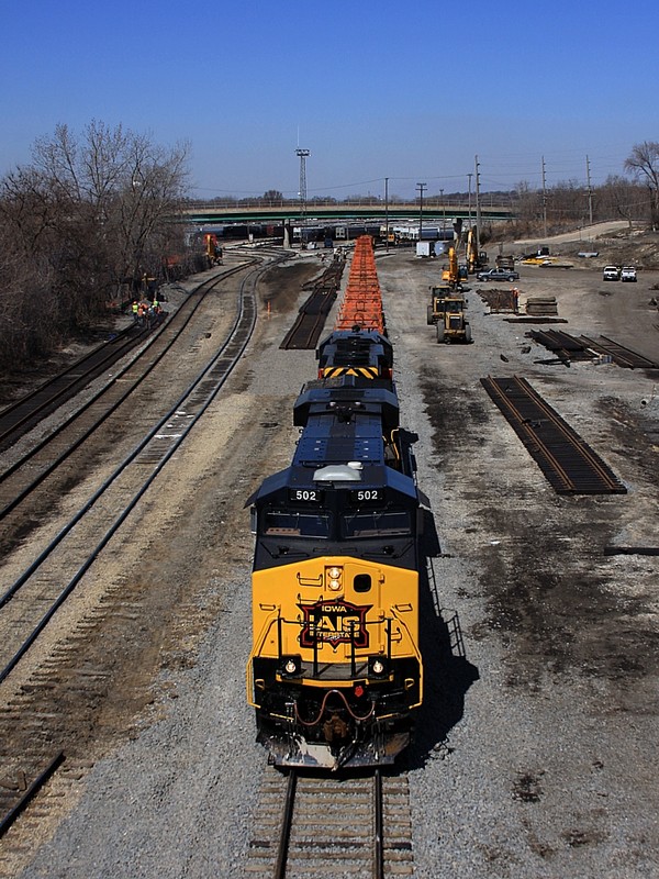 The IAIS 502 & 156 depart the EJ&E Joliet Yard after picking up 15 EJ&E covered coil cars, on each side you can see all the track changes that CN is making to the yard