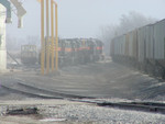 After tying down the empties, BICB's power runs around them on the elevator track, returning to their train back on the mainline at Atlantic.  Note the elevator's switcher on the pocket track to the left.