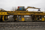 BNSF's Plasser American Tie Machine @ 44th St; Rock Island, IL. The new ties are fed to the tie installers from above.  March 25, 2009.