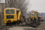 BNSF Plasser American Tie Machines in Rock Island, IL. The first machine is pulling out the old ties while the following machine inserts new ties.  March 25, 2009.