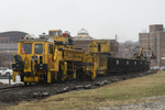 BNSF's Plasser American Tie Machine in Moline, IL.  This machine installs new ties while the backhoes pick up the old ties.  March 24, 2009.