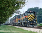 GP38 602 leads GP8 402, LLPX 2039, and 4 former SSW/SP GP40-2's heading to NRE's Dixmoor shops for rebuilding. They are cruising through New Lenox with a CBBI type train 07-22-04