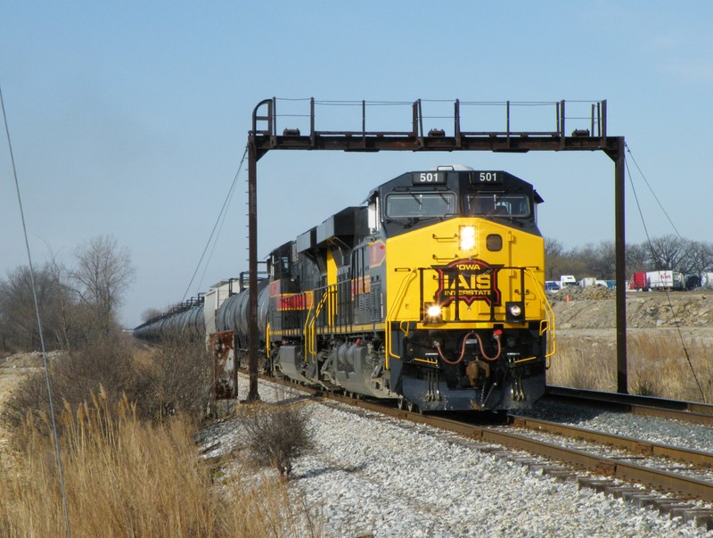 Iowa 501 leads an identical brother on a RINSU type train through the yard limits of Rockdale.