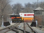 Its not everyday there is a meet on the Metra double track, especially in daylight! A temporarily re-scheduled BICB sits waiting for the tail end of the eastbound RINSU to clear the single track at Joliet UD tower before continuing west, The two trains are crossing the EJ&E, now CN, diamonds.