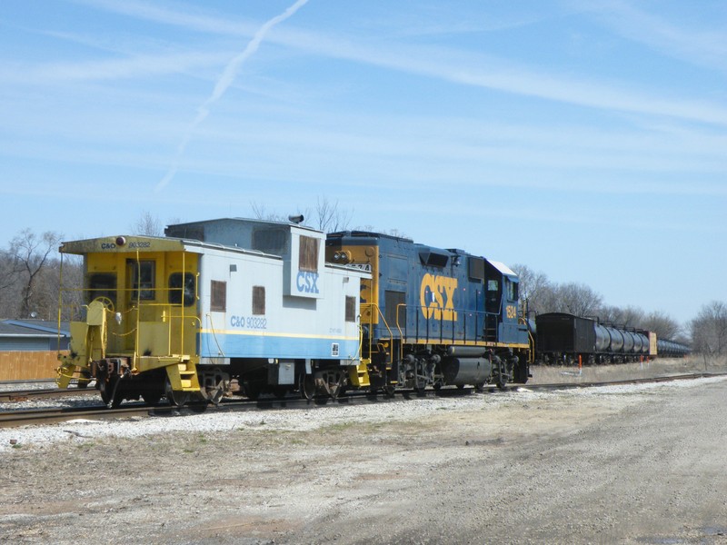 A neat C&O lettered CSX Cupola Caboose sits with the local power in the Seneca house track.