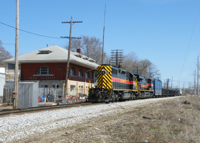 After receiving word of a second westbound departing Blue Island, I made this my last shot of Iowa 154 west and doubled back to Minooka. The train is passing the restored La Salle/Peru RI depot.