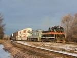 In early AM light, Iowa 250 and 495 double their stack train in UP's CB yard before heading back south toward their yard.