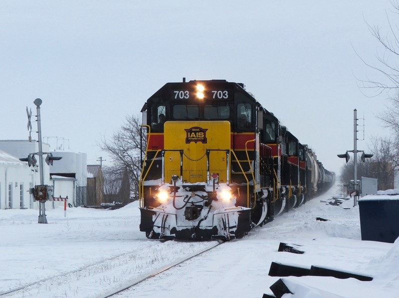 The RI turn passing some newly deposited ties along the ROW at Walcott, IA.