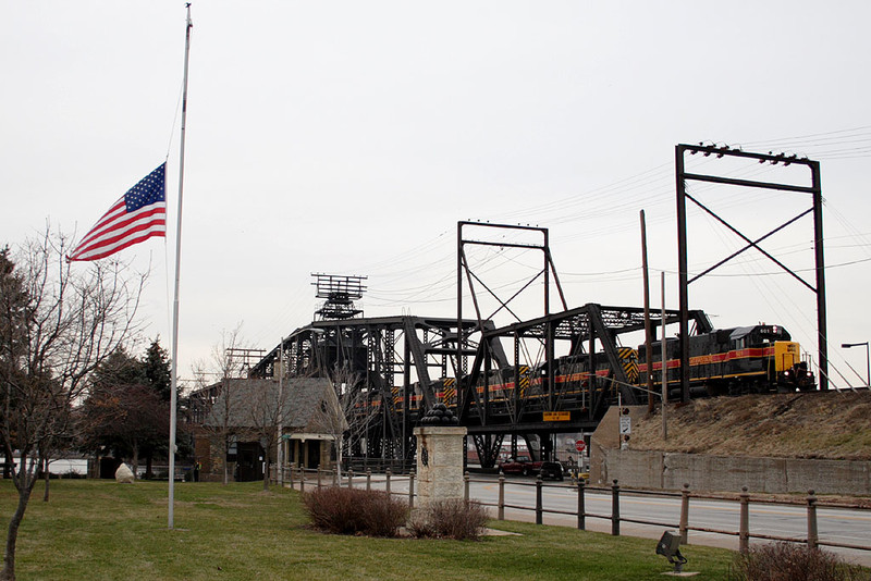 IAIS 601 with CBBI-27 @ Government Bridge; Rock Island, IL.   The flag flying at half-mast is in honor of the late President Gerald Ford.