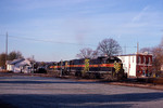 Iowa Interstate CBBI is greeted by early morning frost and long shadows as it passes by the former Rock Island station at Bureau, Il in November of 2001.  Photo by Bob Jordan